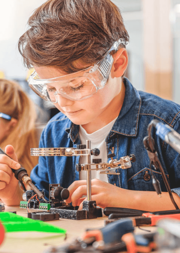 Child working on a robotics project